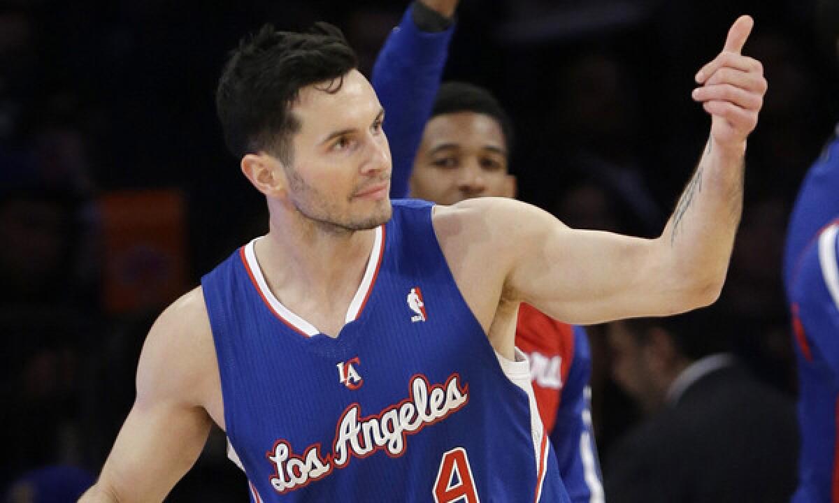 Clippers guard J.J. Redick reacts after sinking a three-pointer in Friday's win over the New York Knicks. Redick suffered a bruised knee in Saturday's loss to the Indiana Pacers.