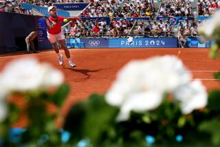 PARIS, FRANCE July 31, 2024-Serbia's Nikola Djokovic hits the ball against Germany's Dominik Koepfer.