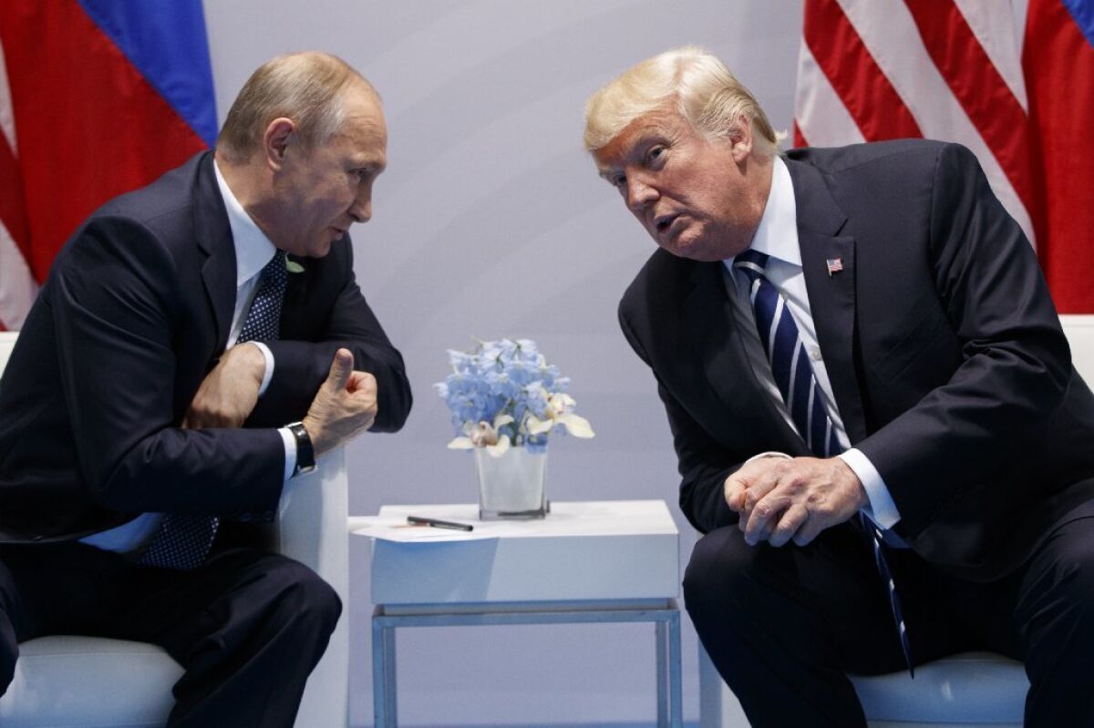 Donald Trump speaks with Russian President Vladimir Putin at the G20 Summit, July 7, 2017.
