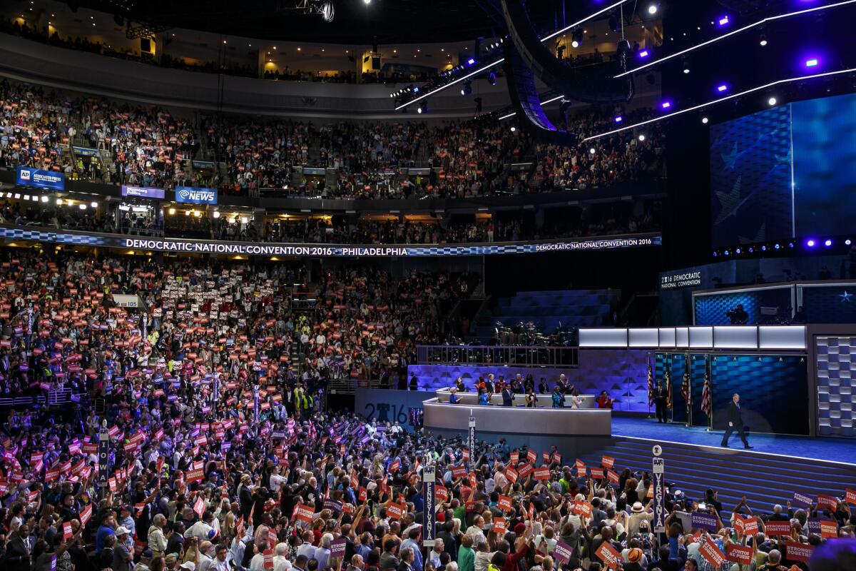 American flags are visible on stage as Tim Kaine arrives to speak on the third night of the convention.