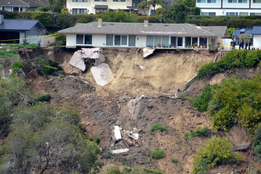 The backyard of a Newport Beach home at 1930 Galaxy Dr. has crumbled due to a landslide.