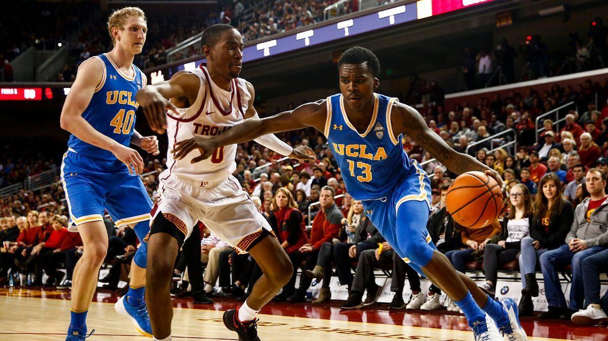 UCLA Bruins Kris Wilkes (13) drives to towards the basket against USC during a game at the Galen Center on Saturday.