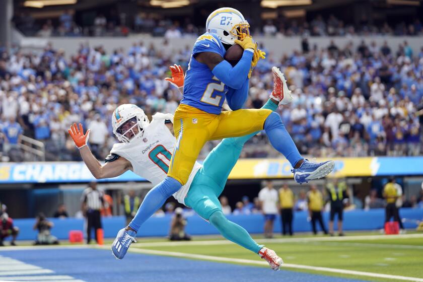 Los Angeles Chargers cornerback J.C. Jackson (27) intercepts a pass in the end zone intended for Miami Dolphins wide receiver Braxton Berrios during the second half of an NFL football game Sunday, Sept. 10, 2023, in Inglewood, Calif. (AP Photo/Ashley Landis)