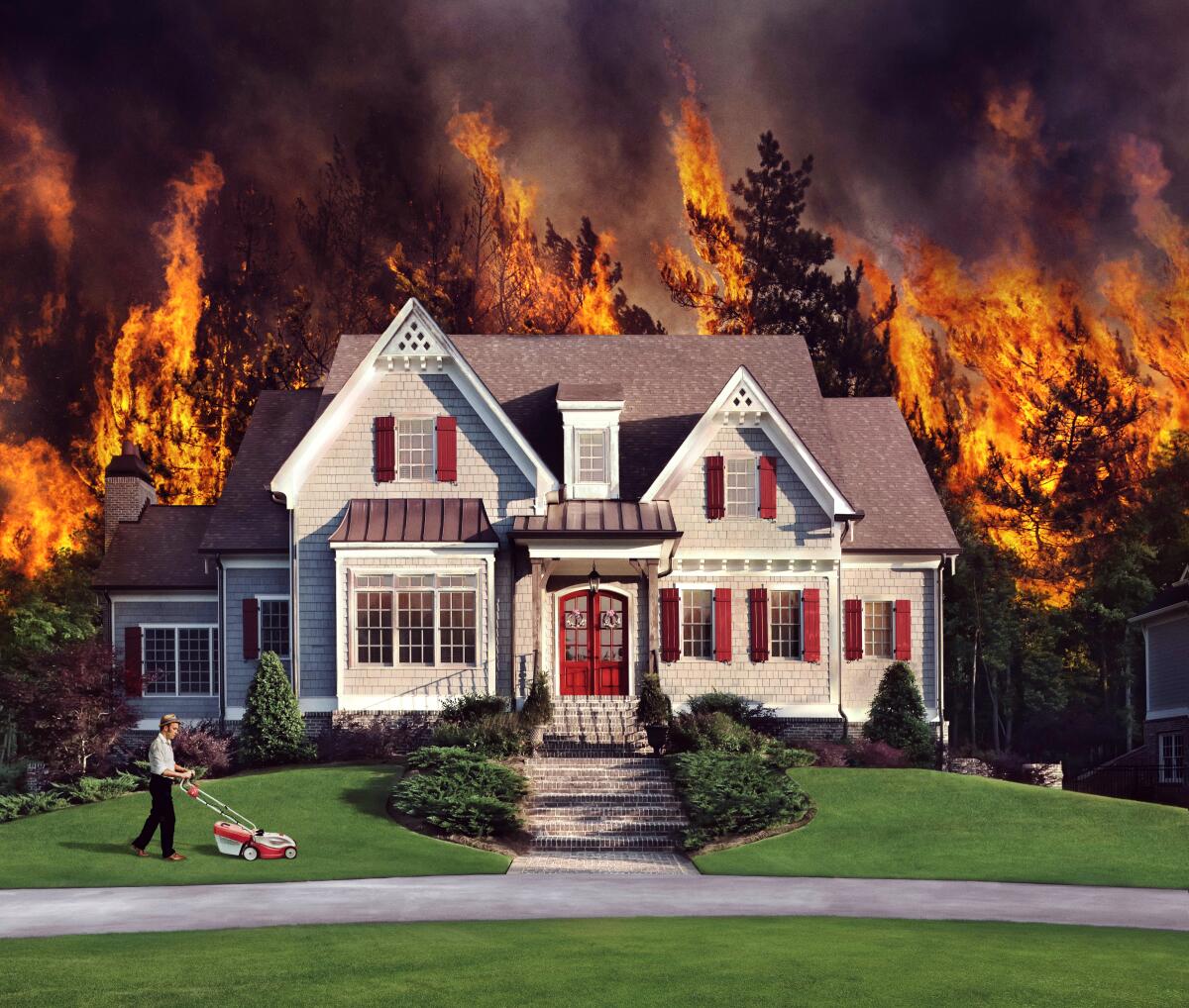 House with a fire behind it and someone mowing the lawn out front