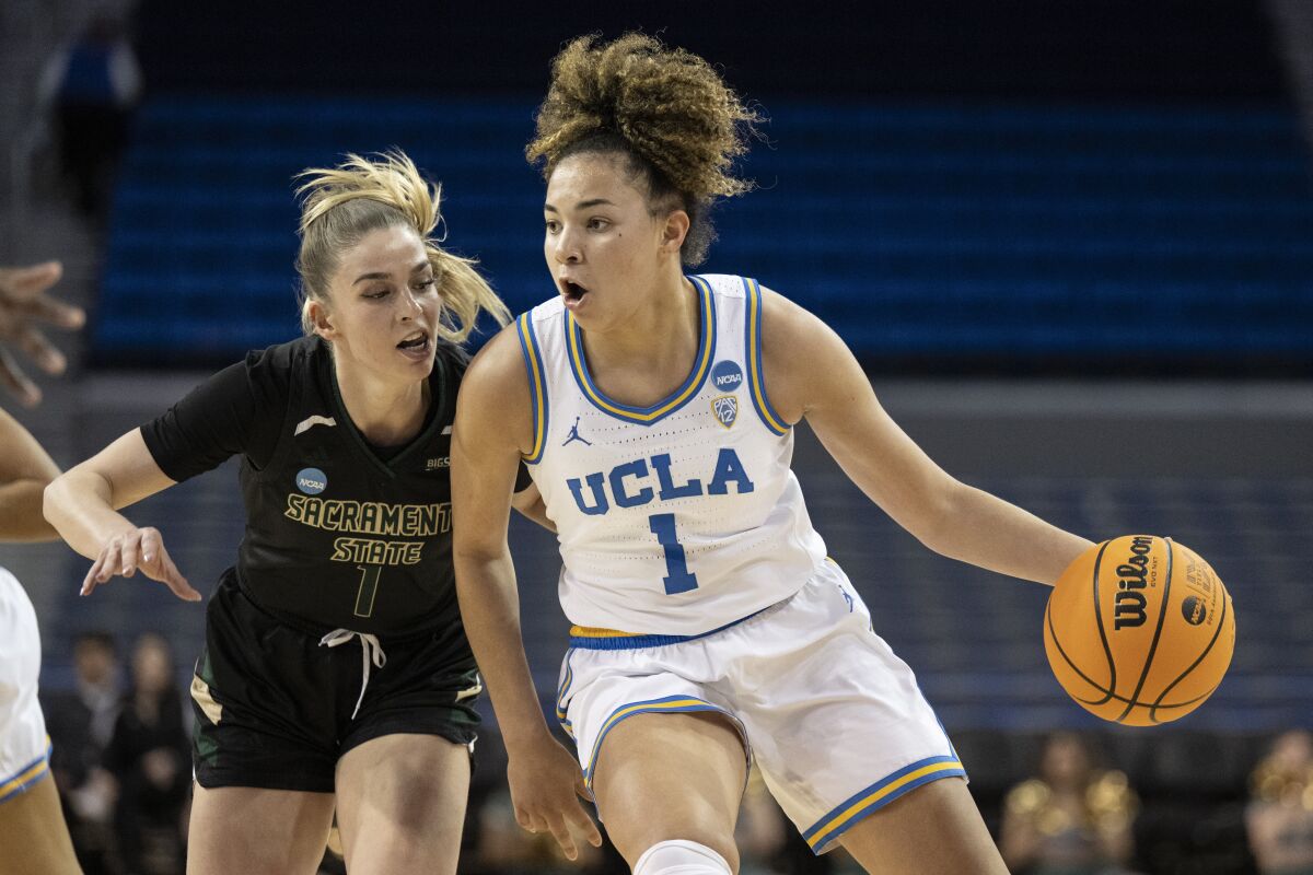UCLA guard Kiki Rice, right, drives as Sacramento State guard Benthe Versteeg defends during the second half of a first-round college basketball game in the women's NCAA Tournament, Saturday, March 18, 2023, in Los Angeles. (AP Photo/Kyusung Gong)