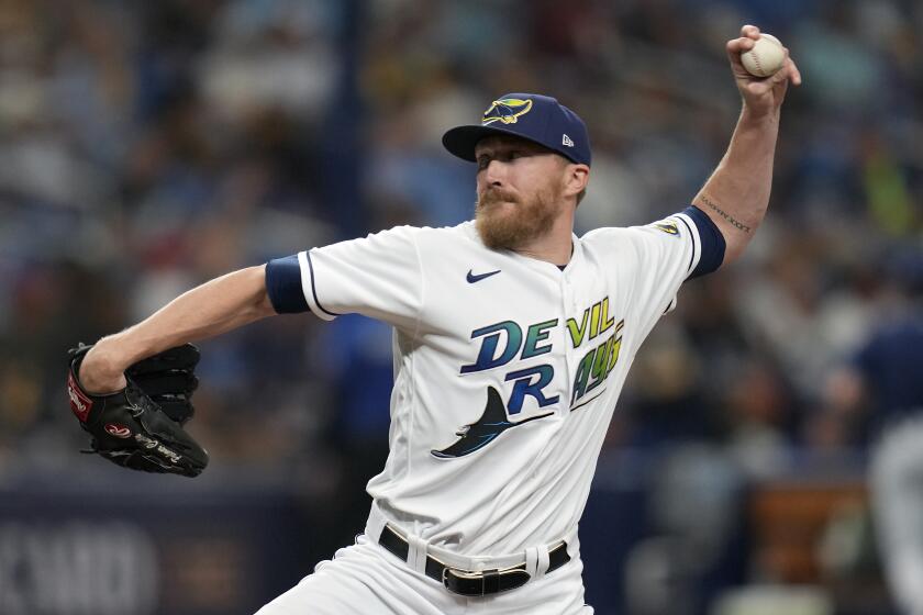 Tampa Bay Rays relief pitcher Jake Diekman throws to a Texas Rangers batter during the eighth inning of Game 1 of an AL wild-card baseball playoff series Tuesday, Oct. 3, 2023, in St. Petersburg, Fla. (AP Photo/John Raoux)