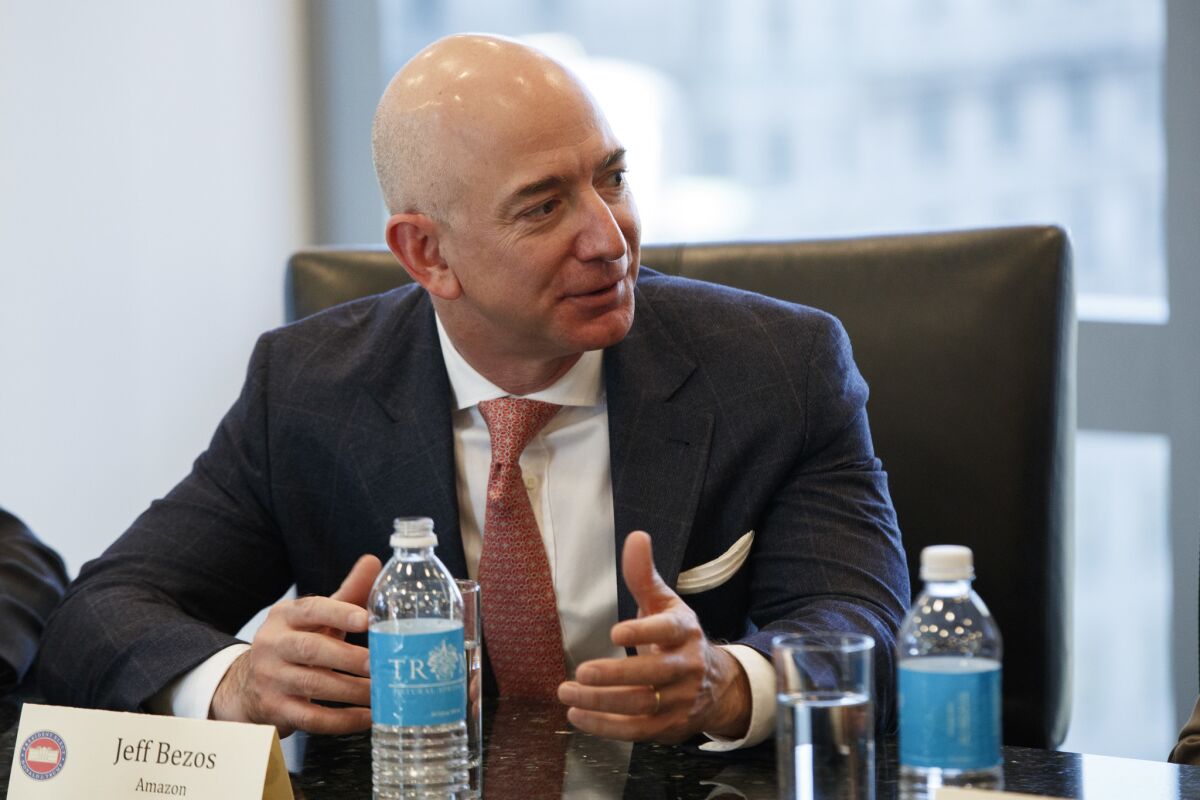 Jeff Bezos speaks during a meeting with then-President-elect Donald Trump and technology industry leaders at Trump Tower in New York on Dec. 14, 2016.