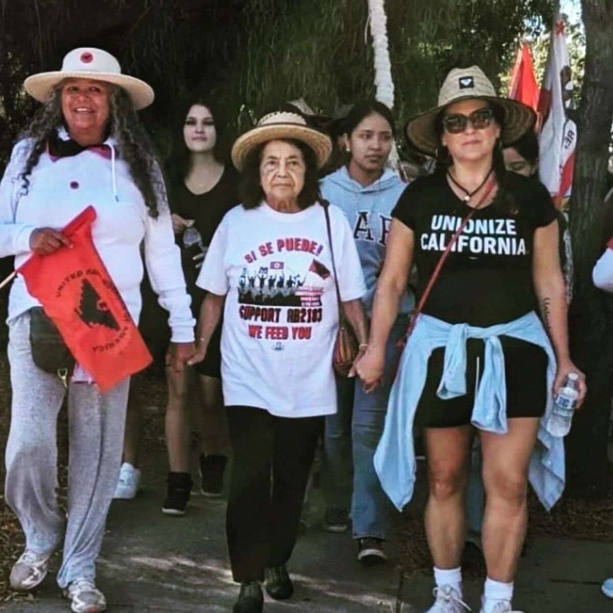 Dolores Huerta, Teresa Romero, and Lorena Gonzalez Fletcher during the portion of UFW's march to support AB 2183.