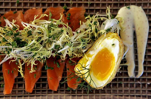 Venice's new AK Restaurant + Bar from former Four Seasons hotel chef and Swede Conny Andersson features a global bistro menu, including a baby frisée salad with smoked salmon strips and a poached egg thats been breaded and fried.