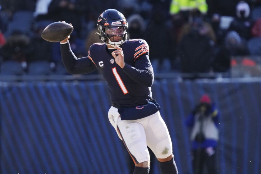Chicago Bears quarterback Justin Fields throws during the first half of an NFL football game against he Buffalo Bills, Saturday, Dec. 24, 2022, in Chicago. (AP Photo/Nam Y. Huh)