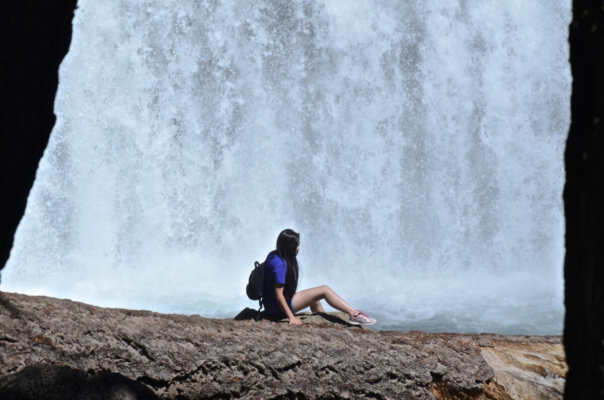 Hiker at Northern California's McCloud Falls, Middle Fall. (Christopher Reynolds/Los Angeles Times)