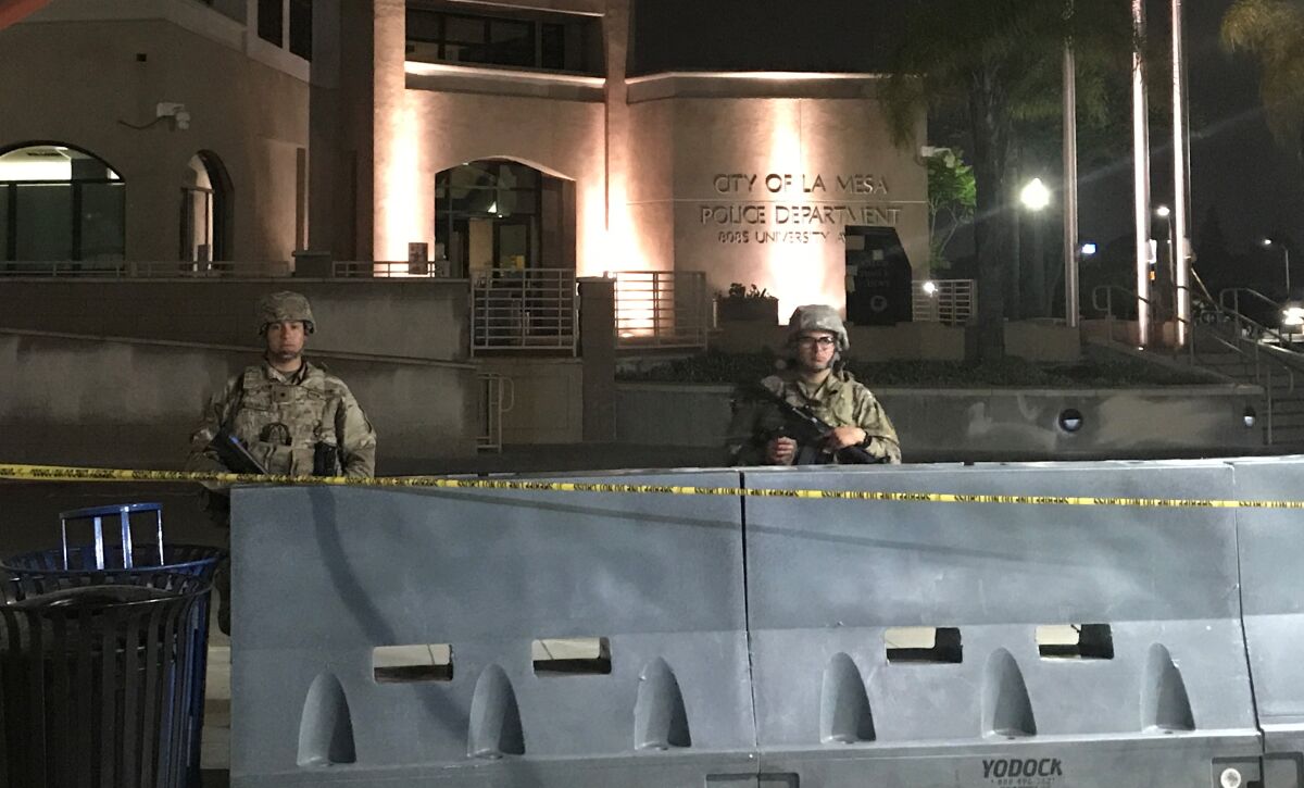 National Guard troops stand watch June 3 outside La Mesa Police Department headquarters. 