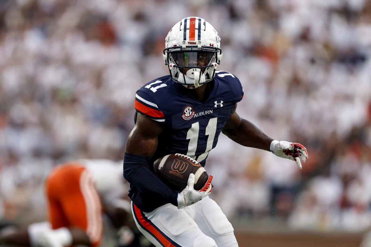 Auburn wide receiver Shedrick Jackson carries the ball against Mercer during the first half of an NCAA college football game Saturday, Sept. 3, 2022, in Auburn, Ala. (AP Photo/Butch Dill)