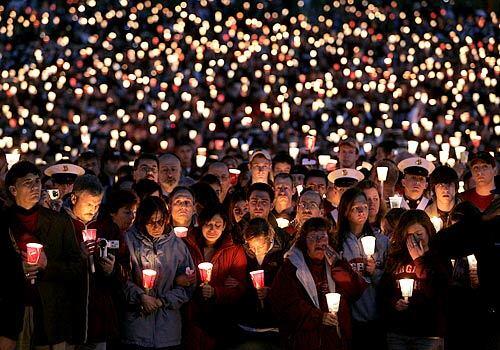 Thousands of Virginia Tech students, staff, family and supporters fill the University's parade grounds for somber, yet emotional candlelight vigil.