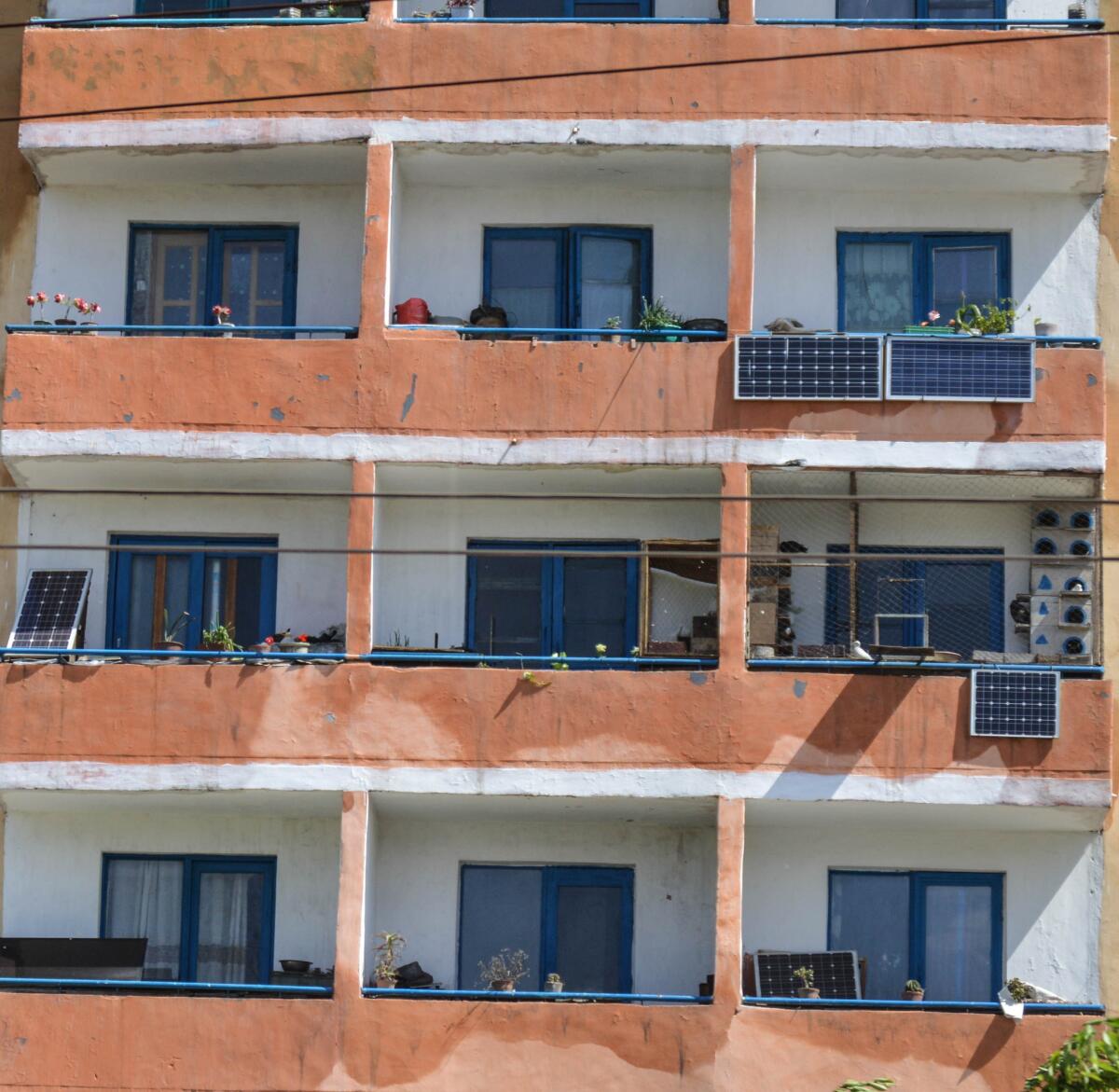 Solar panels seen on individual balconies at an apartment building in Pyongyang, North Korea. (Julie Makinen / Los Angeles Times)