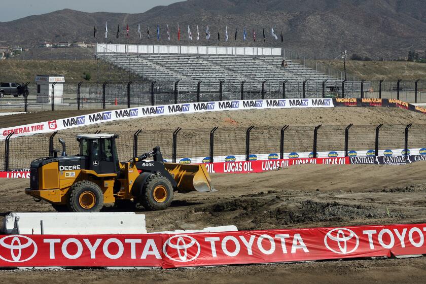 April 18, 2012 File Photograph. A tractor works on grading the race track Wednesday at Lake Elsinore Motorsports Park before the offroad truck races are held this weekend. BILL WECHTER | bwechter@californian.com