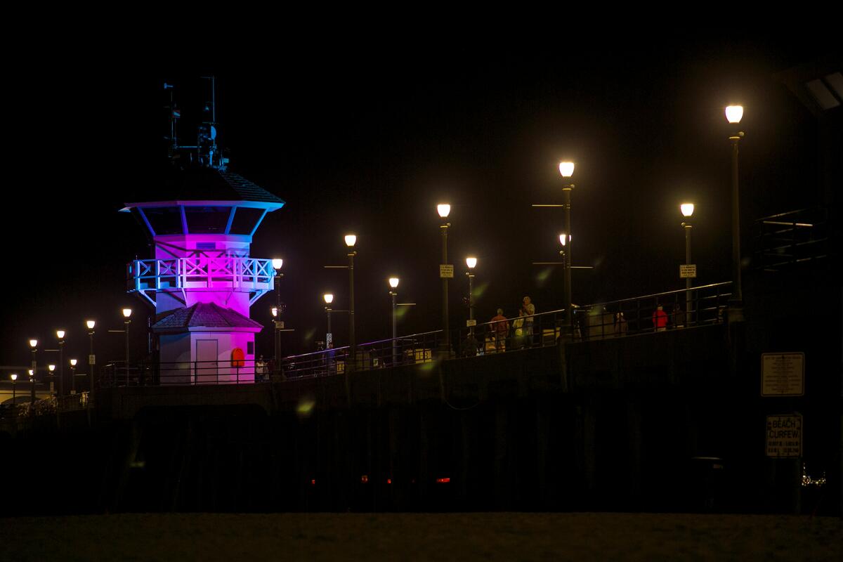 Huntington Beach's Lifeguard Tower Zero was lit Tuesday as part of a initiative led by the Orange County Health Care Agency.