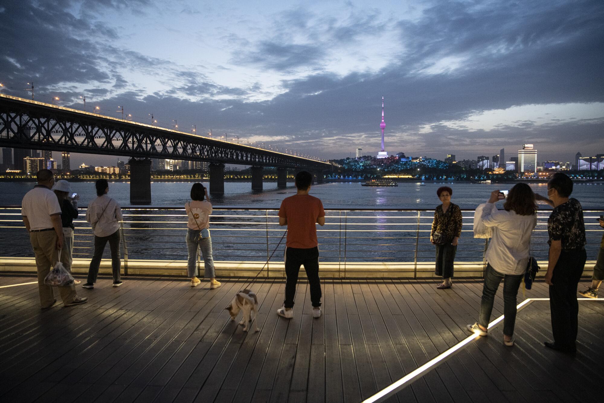 The Yangtze River at dusk next to Wuhan Yangtze River Bridge in Wuhan, China.