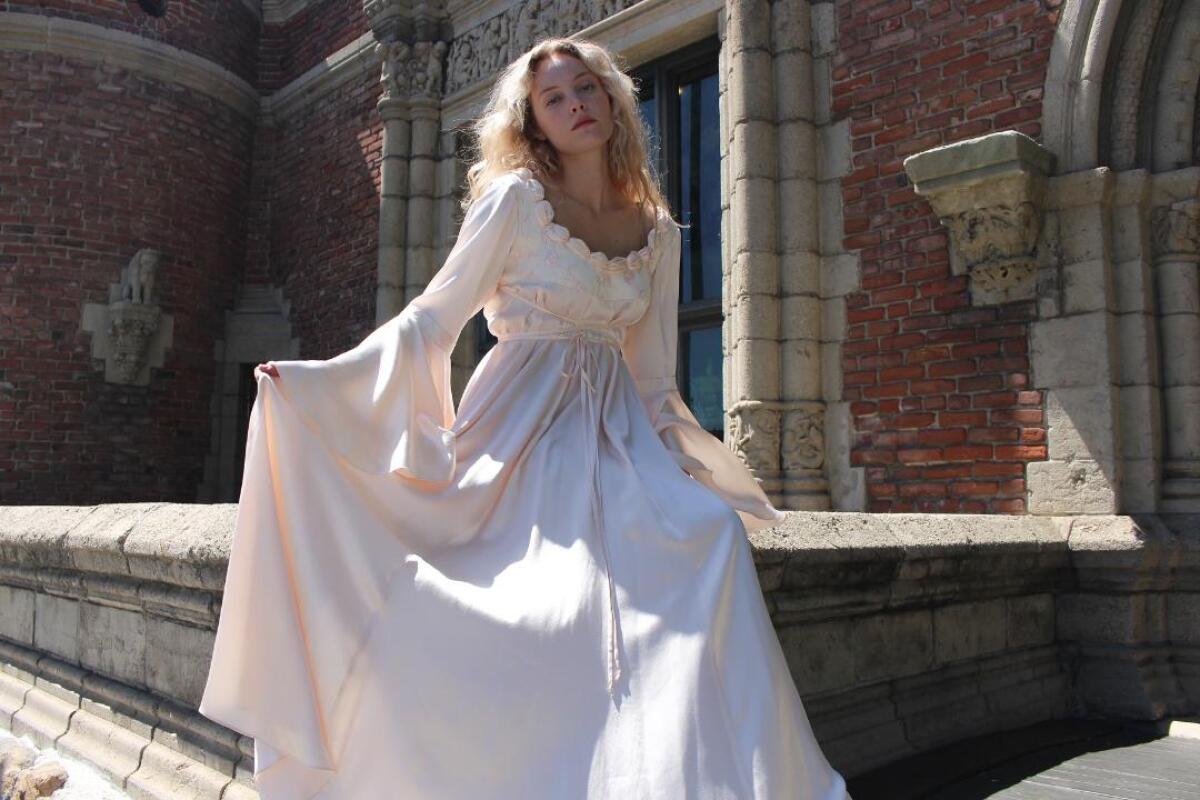 A woman in a vintage wedding gown from the Kit Vintage.