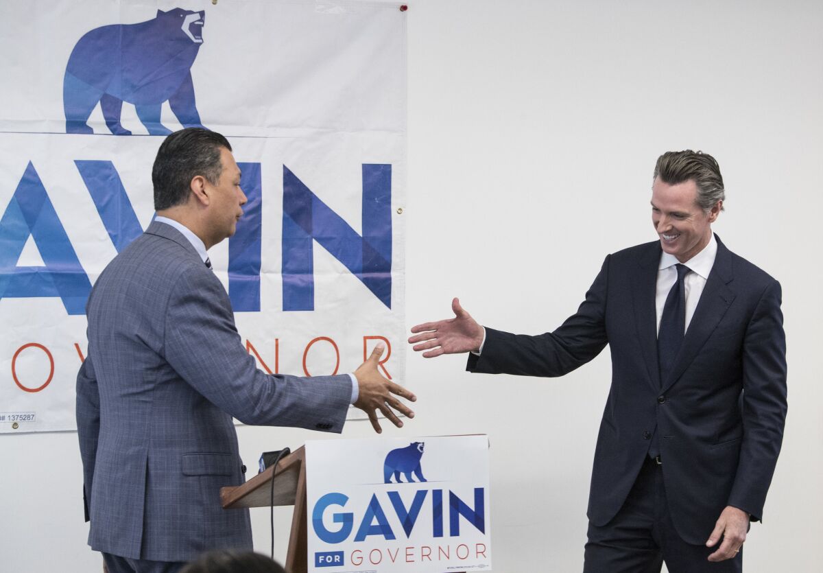 California Secretary of State Alex Padilla, left, and Lt. Gov. Gavin Newsom