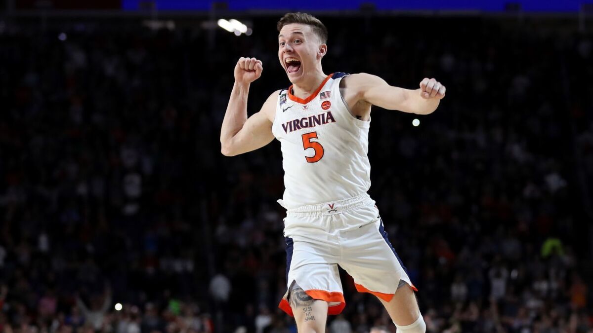 Virginia's Kyle Guy celebrates the Cavaliers' 85-77 win over Texas Tech in the NCAA men's basketball championship game on Monday.