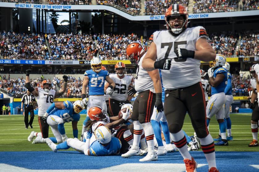 INGLEWOOD, CA - OCTOBER 10, 2021: Cleveland Browns guard Joel Bitonio (75) reacts in the end zone as Cleveland Browns running back Kareem Hunt (27) scoes on a fourth down and 1 yard play against the Chargers in the second quarter at SoFi Stadium on October 10, 2021 in Inglewood, California.(Gina Ferazzi / Los Angeles Times)