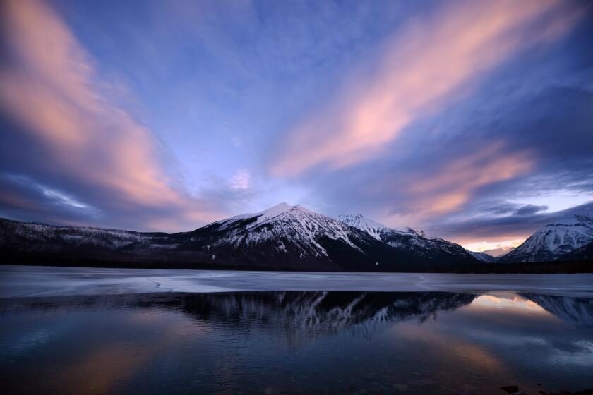 A snowy sunrise over Lake McDonald in Glacier National Park in Northwest Montana.