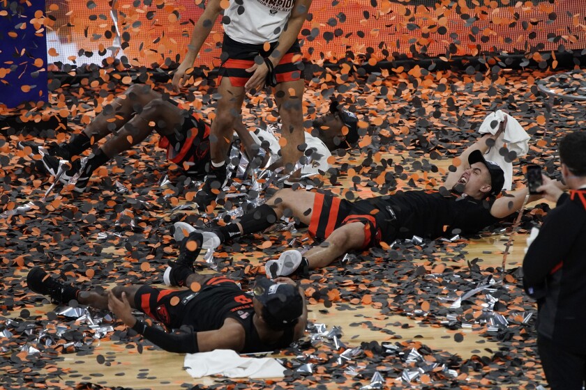 Oregon State's Jarod Lucas, right, celebrates with teammates after they beat Colorado on March 13, 2021, in Las Vegas.