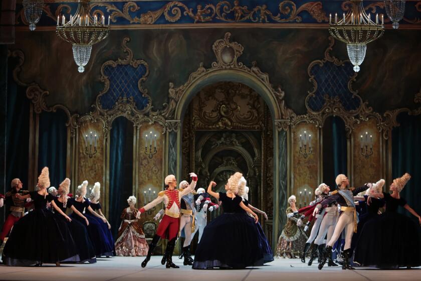 Ladies of the court and officers of the royal guard dance the courtly sarabande in the Mikhailovsky Ballet's revival of "The Flames of Paris" in New York.
