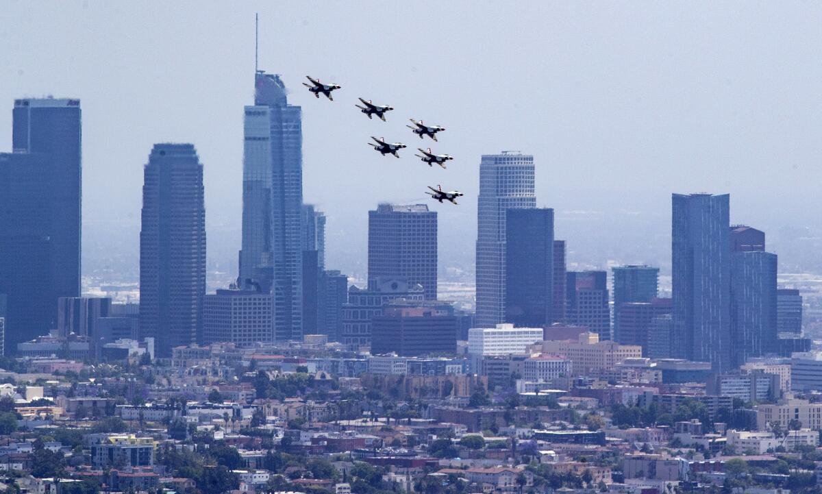 The Air Force Thunderbirds fly in formation over downtown Los Angeles Friday afternoon.