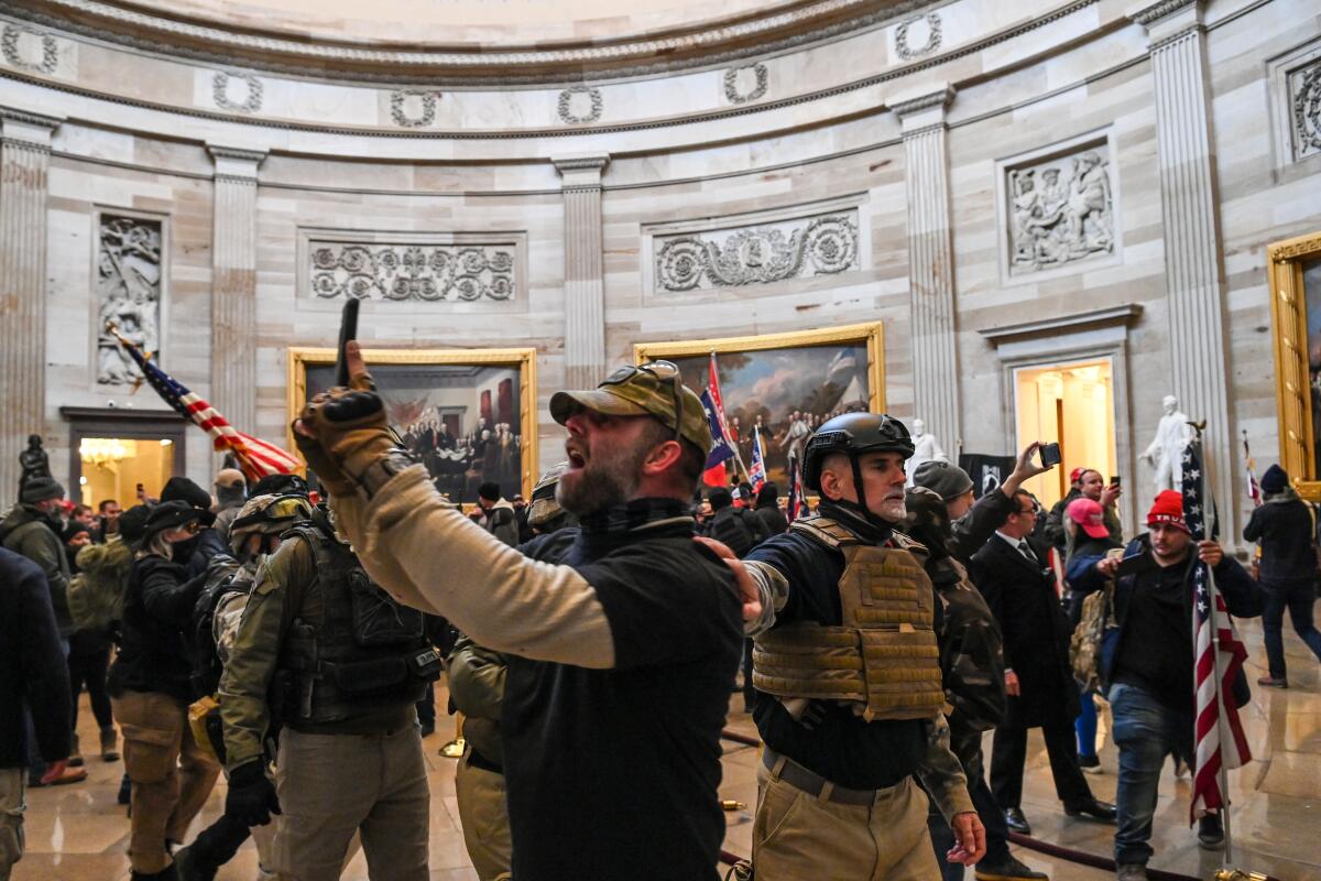 Supporters of President Trump enter the U.S. Capitol's Rotunda