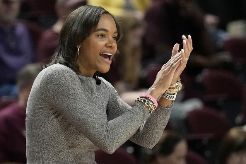 Texas A&M coach Joni Taylor applauds during the first half of the team's NCAA college basketball game against Texas A&M-Corpus Christi on Thursday, Nov. 10, 2022, in College Station, Texas. (AP Photo/Sam Craft)