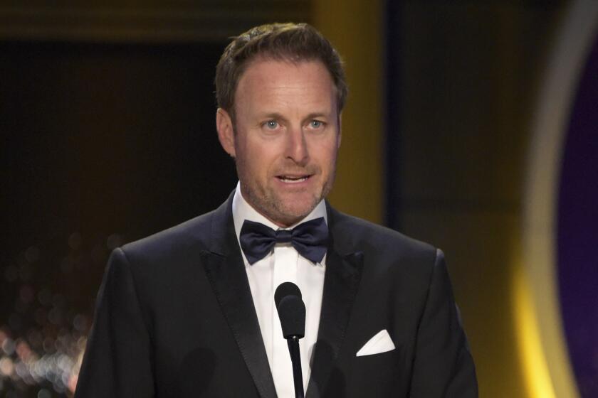 FILE - In this April 29, 2018, file photo, Chris Harrison presents the award for outstanding entertainment talk show host at the Daytime Emmy Awards at the Pasadena Civic Center in Pasadena, Calif. Harrison is stepping aside as host of "The Bachelor" franchise. (Photo by Richard Shotwell/Invision/AP, File)