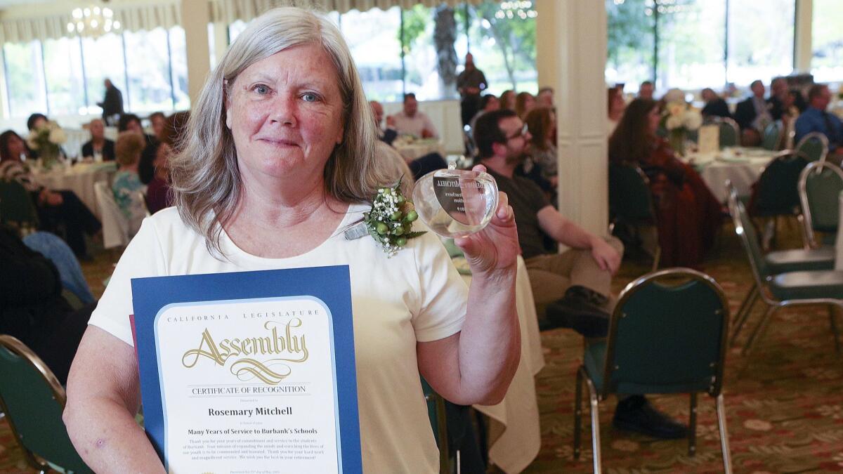 Retiring Burroughs High School teacher Rosemary Mitchell was honored at the Burbank Teachers Assn.'s reception at Pickwick Gardens in Burbank on Wednesday. The BTA recognized retiring teachers and educators with 25 years of service to the district.