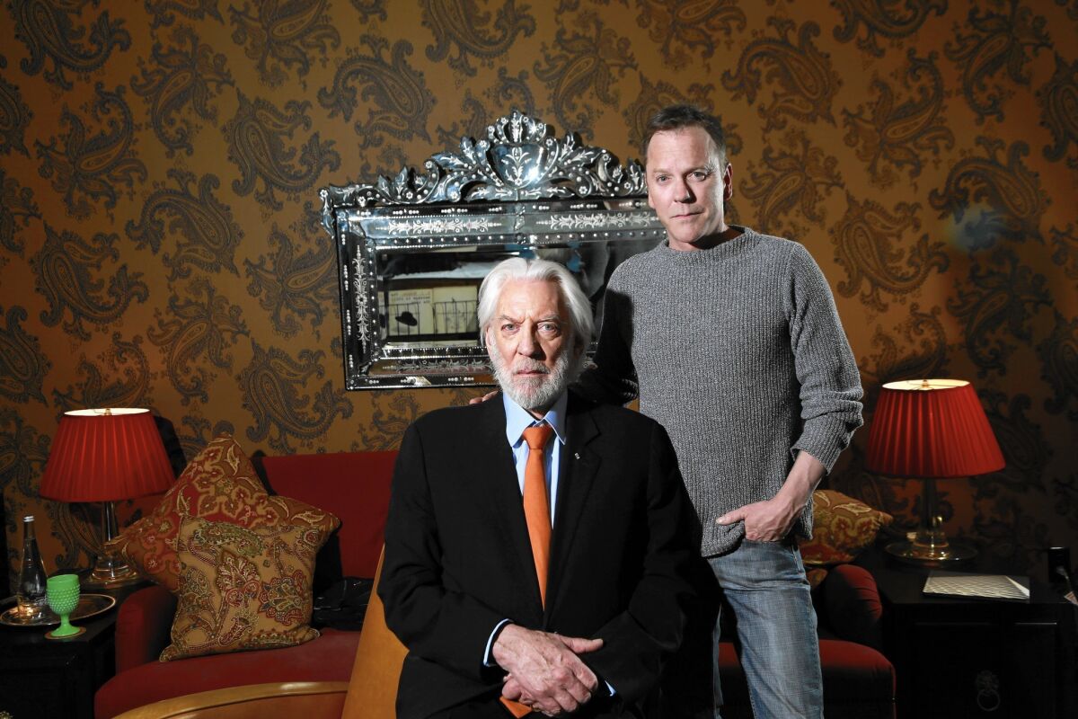Donald Sutherland, sitting, and son Keifer Sutherland, starring in the wester "Forsaken," are shown at the Redbury Hotel in Hollywood.