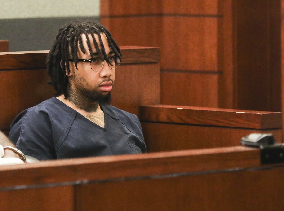 Marqel Cockrell appears at an extradition hearing at the Regional Justice Center in Las Vegas, Thursday, April 14, 2022. Police say Cockrell, a Southern California shoe store owner opened fire at two shoplifters but mistakenly shot a 9-year-old girl about to have her picture taken with a mall Easter bunny. He fled the state and was arrested in Nevada.(Rachel Aston/Las Vegas Review-Journal via AP)