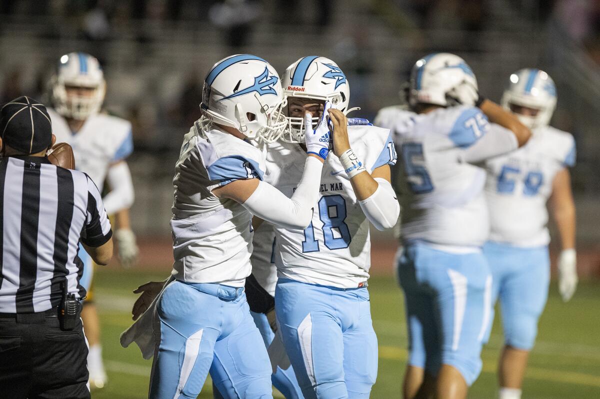 Corona del Mar's Max Lane, left, celebrates with David Rasor after he scored during Friday's game against Edison.
