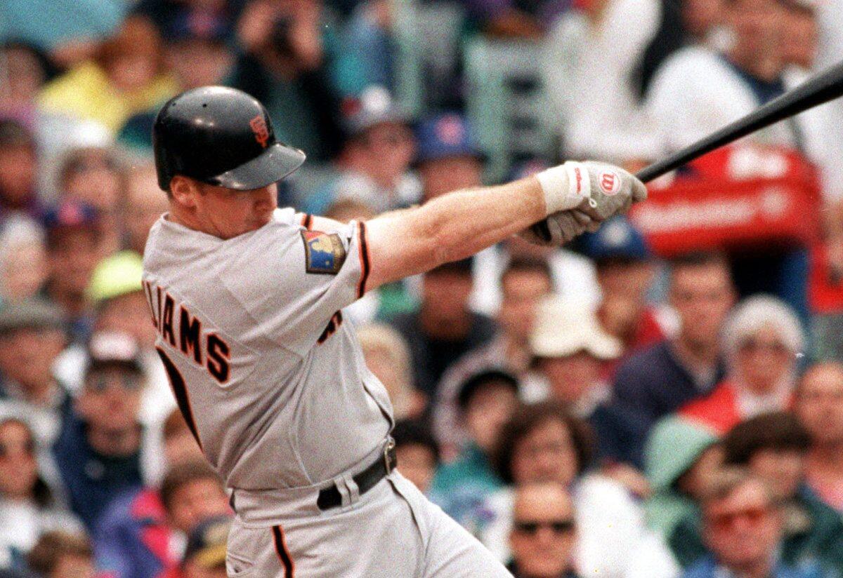 Giants third baseman Matt Williams hits a two-run double against the Chicago Cubs on Aug. 10, 1994, at Wrigley Field.