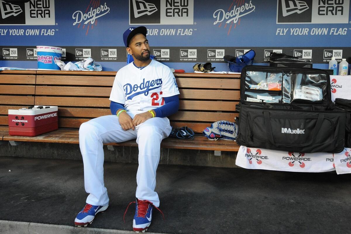Dodgers center fielder Matt Kemp sits in the dugout during Saturday's game against the Colorado Rockies.