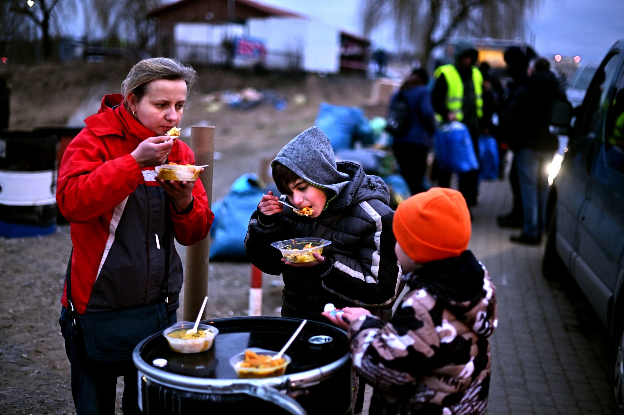 A refugee family eats in Medyka, Poland 