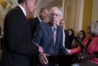 U.S. Senate Minority Leader Mitch McConnell, R-Ky., center, is helped by, from left, Sen. John Barrasso, R-Wyo., Sen. John Thune, R-S.D., and Sen. Joni Ernst, R-Iowa, after the 81-year-old GOP leader froze at the microphones as he arrived for a news conference, Wednesday, July 26, 2023, at the Capitol in Washington. (AP Photo/J. Scott Applewhite)
