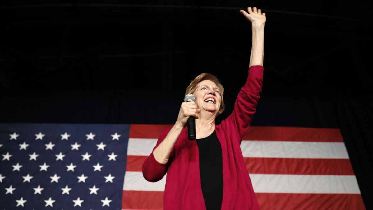 Sen. Elizabeth Warren (D-Mass.), who has announced her presidential candidacy, waves to the crowd during an organizing event in Des Moines on Jan. 5.