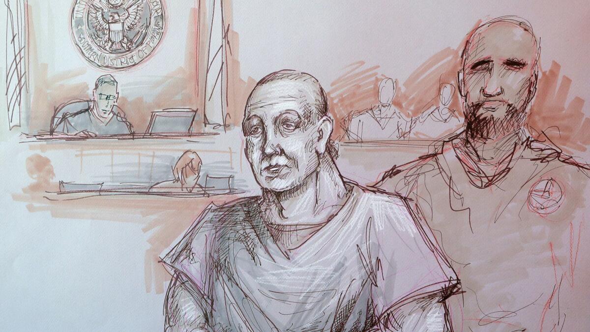 In this sketch, Cesar Sayoc, center, appears in federal court on Monday in Miami. Sayoc is accused of sending pipe bombs to prominent Democrats, critics of President Trump and media outlets around the country.