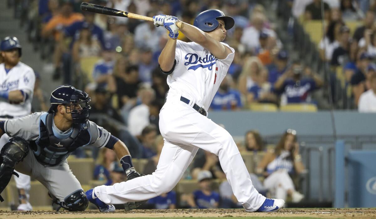 Dodgers' Corey Seager follows through on an RBI single during the third inning against the Tampa Bay Rays on Tuesday.