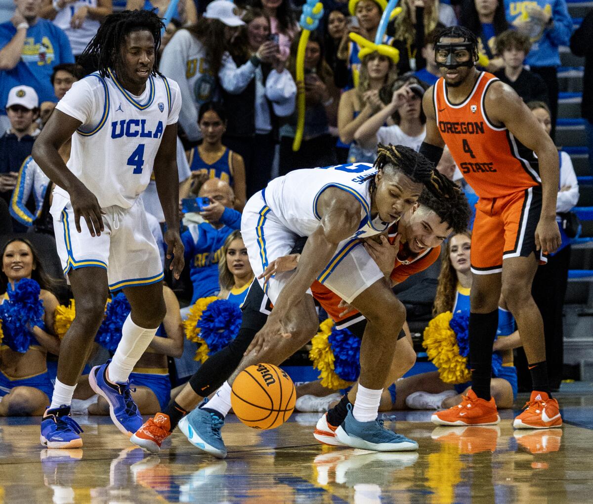 UCLA guard Dylan Andrews steals the ball from Oregon State guard Jordan Pope.