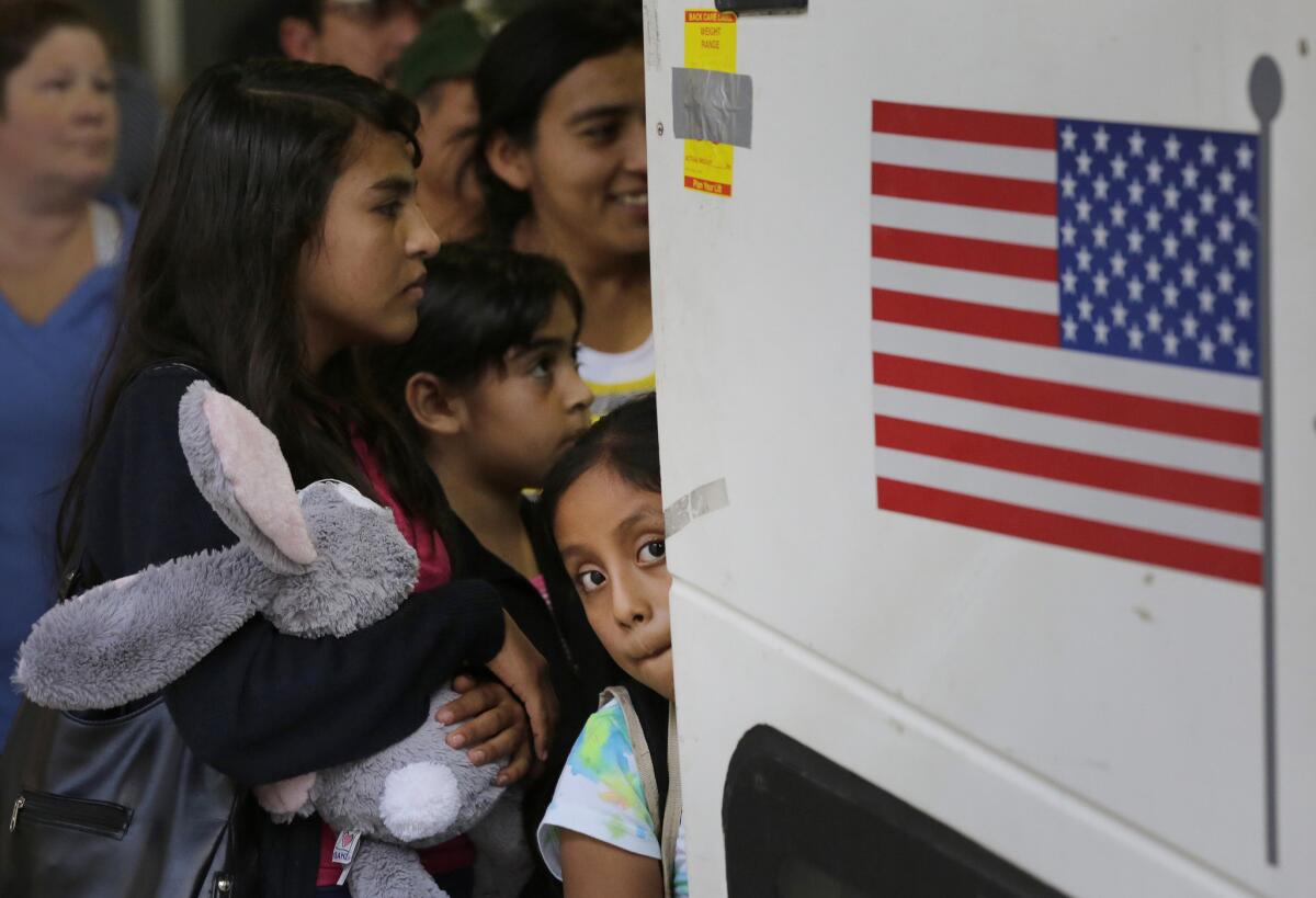 Salvadoran and Guatemalan immigrants who entered the U.S. illegally board a bus after being released from a family detention center in San Antonio.
