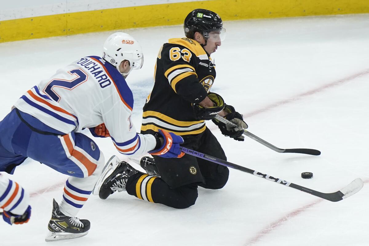 Boston Bruins take issue with hit that forced Brad Marchand from