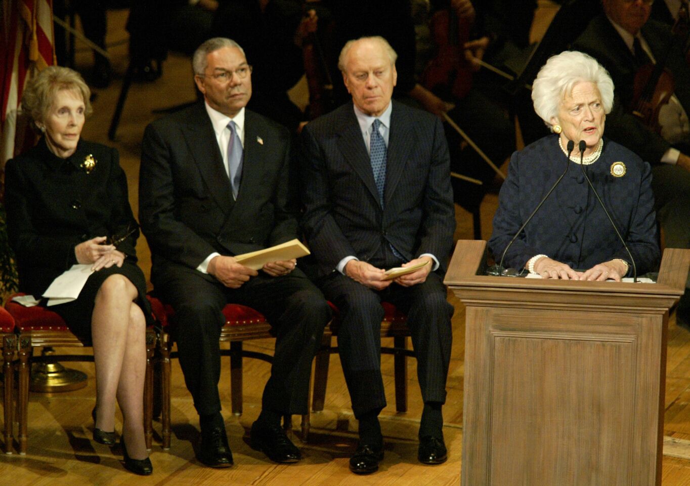 Former First Ladies Barbara Bush, right, and Nancy Reagan, former U.S. Secretary of State Colin Powell and former President Ford attend a memorial service in December 2002 in Philadelphia honoring Walter Annenberg, the billionaire media pioneer who died at 94.