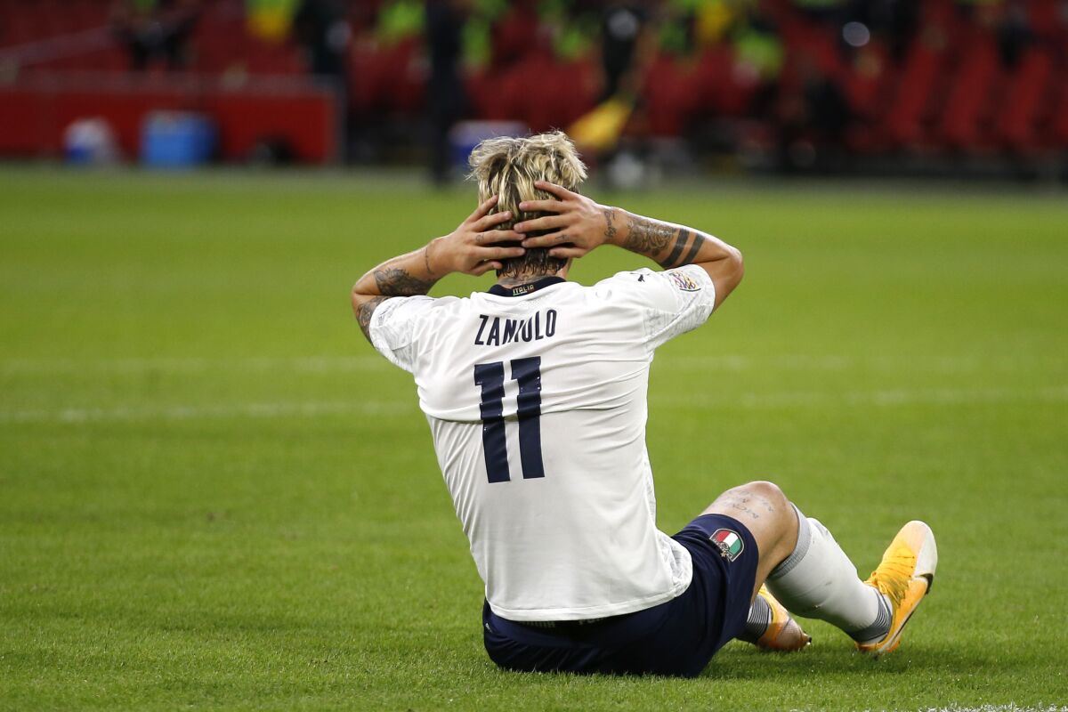 Italy's Nicolo Zaniolo reacts after missing a scoring chance during the UEFA Nations League soccer match between The Netherlands and Italy at the Johan Cruijff ArenA in Amsterdam, Netherlands, Monday, Sept. 7, 2020. (AP Photo/Peter Dejong)
