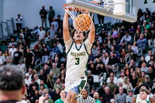 Jacob De Armas of Mira Costa delivers dunk against Santa Barbara.
